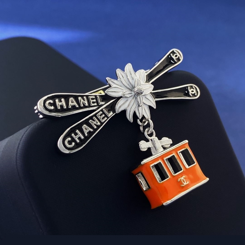 Ch*el brooches